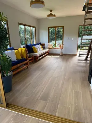 a living room with couches and a large mirror at Villa Mis Núñez