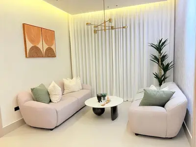 a living room with two chairs and a table at Apartment in Downtown, DN in Colorado