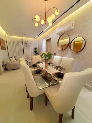 a dining room with white chairs and a table and mirrors at Apartment in Downtown, DN in Colorado