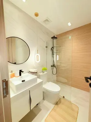 a bathroom with a toilet and a sink and a mirror at Apartment in Downtown, DN in Colorado