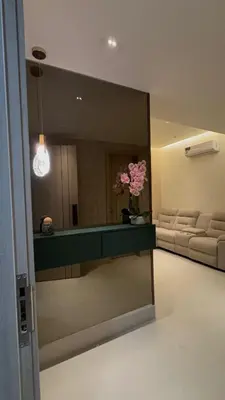 a large mirror in a room with a living room at Apartment in Downtown, DN in Colorado