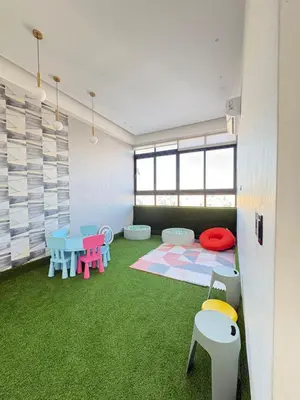 a room with a table and chairs and green carpet at Apartment in Downtown, DN in Colorado
