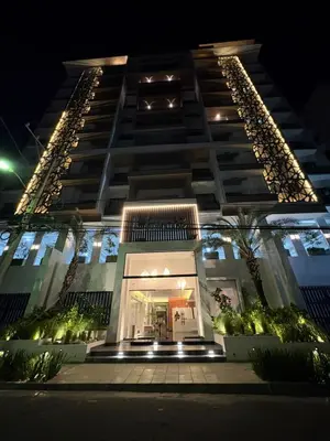a tall building with a lit up entrance at night at Apartment in Downtown, DN in Colorado