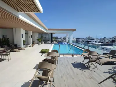 a balcony with chairs and a swimming pool on a building at Apartment in Downtown, DN in Colorado