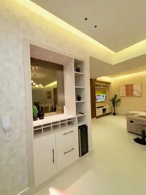 a living room with white cabinets and a large mirror at Apartment in Downtown, DN in Colorado