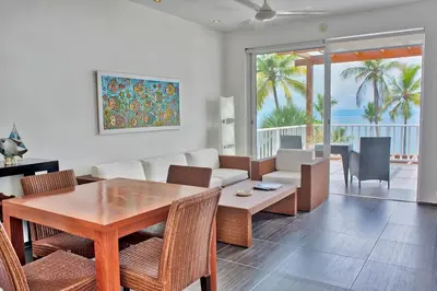 a living room with a table and a couch at Ballena Bay View in Punta Balandra