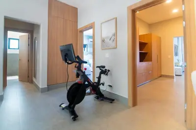 a room with a exercise bike and a mirror at Playa Bonita Fully Serviced Villa - Walk to Beach in Las Terrenas