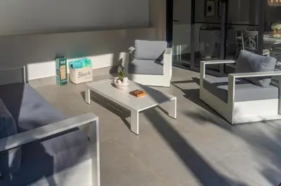 a living room with two chairs and a coffee table at Playa Bonita Fully Serviced Villa - Walk to Beach in Las Terrenas