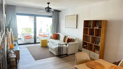 a living room with a couch and a table at Beautiful apartment Bavaro Beach in Punta Cana
