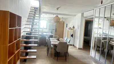 a dining room and kitchen with a table and chairs at Beautiful apartment Bavaro Beach in Punta Cana