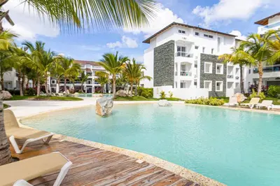 a swimming pool in front of a building at Elegant 1-BD Luxury Escape in Paradise in Estrella
