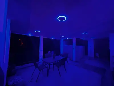 a blue room with a table and chairs in it at Casa Villa para grupos grandes in Ciruelitos Arriba