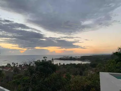 a view of a body of water at sunset at Puerto Plata, beach Pent house in Maggiolo