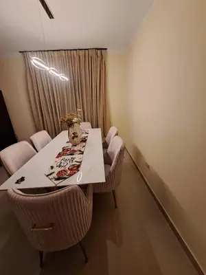 a dining room with a table and chairs and a room at Luxurious and comfortable in the safest area in Juan López