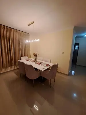 a dining table and chairs in a living room at Luxurious and comfortable in the safest area in Juan López