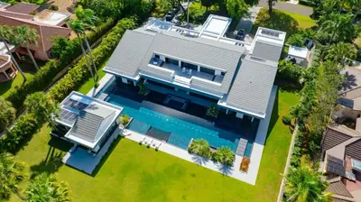 an aerial view of a house with a swimming pool at Luxury villa with Private beach access in Sosúa