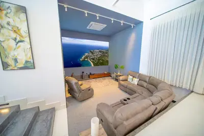 a living room with a couch and two chairs at Luxury villa with Private beach access in Sosúa