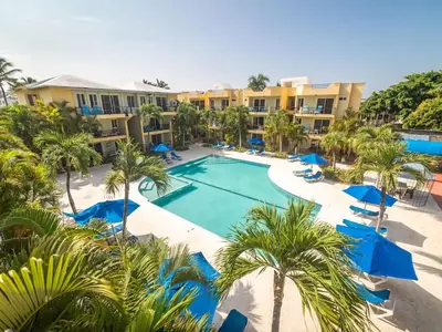 an aerial view of a resort with a pool and palm trees at Garden Condos APT 35 - Affordable 1BR APT in Sosua in Sosúa