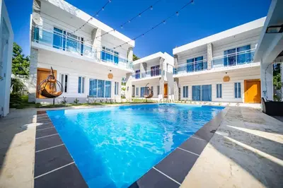 a swimming pool in front of a house at 8BR Private Villa in Sosua 2 mins from Nightlife in Sosúa