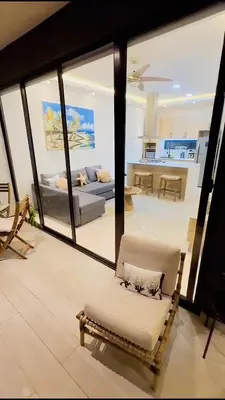 a living room with a couch and a chair at Caribbean Dream Bayahibe Seaside 3Br Penthouse in Bayahibe