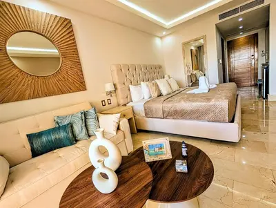 a living room with a bed and a couch at Beautiful Apartment overlooking Samaná Bay
