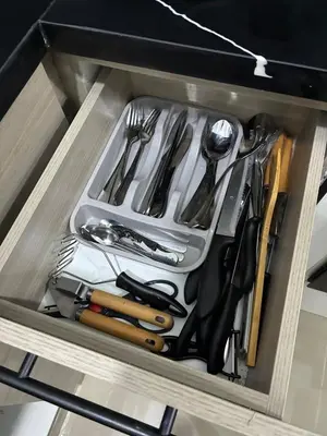 a drawer filled with utensils in a cabinet at Residential hammock 2, next to the brewery in Concepción de La Vega