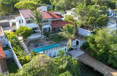 an aerial view of a house with a swimming pool at La casa del lago in Cumayasa