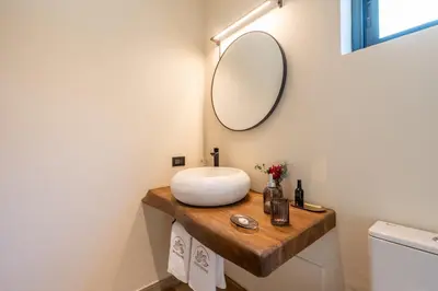 a bathroom with a sink and a mirror on a counter at Villa Libelula, Ocean View, Private Pool,3 Suites in El Limón