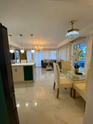 a kitchen and living room with a table and a couch at A space designed for you in San Cristóbal