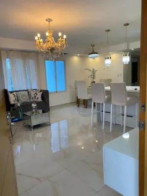 a dining room and living room with a table and chairs at A space designed for you in San Cristóbal