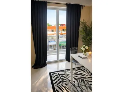 a dining room with a table and a window at Apartement cosy et lumineux in Cuevas
