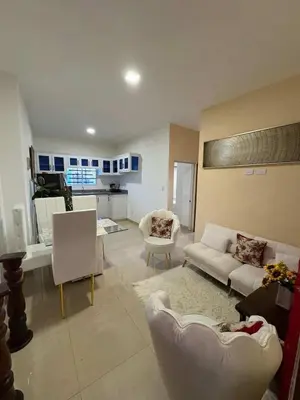 a living room with a couch and chairs in it at Cruzairbnb in San Felipe de Puerto Plata