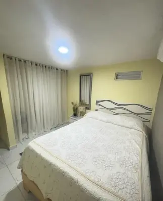 a bedroom with a large white bed in a room at Aparta estudio Lomar II in Puerto Plata