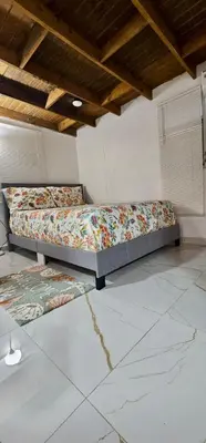 a bedroom with two beds in a room at Coco house by Julio 2 in Nagua