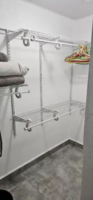 a shelf in a room with towels on it at Coco house by Julio in Nagua