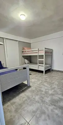 an empty room with two bunk beds in it at Coco house by Julio in Nagua