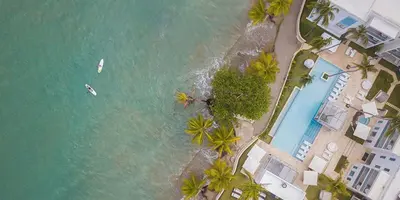 an overhead view of a pool and the ocean at Imperial Suite 1-bedroom ocean view and kitchen in Cabarete