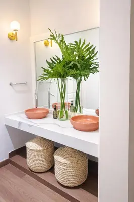 a bathroom with a counter with two sinks and a mirror at Villa Wolf in Punta Cana