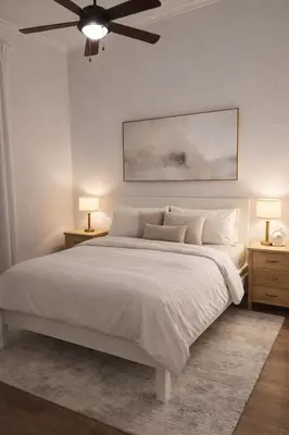 a bedroom with a large white bed with two night stands at Villa Wolf in Punta Cana