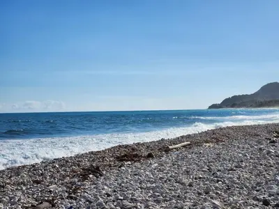 a rocky beach with the ocean in the background at 2 Bdrm 1 Bath Near River and Beach, 3L, Paraiso, Barahona in Paraíso