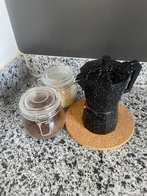 a black vase and two jars on a counter at 2 Bdrm, 1 Bath, Wifi, Near River and Beach, 4R, Paraiso, Barahona in Paraíso