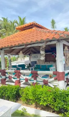 a view of a resort with a gazebo at Arena blanca Franchecis hostal in Juan Dolio