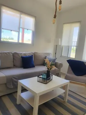 a living room with a couch and a coffee table at Wohlfühloase in der Karibik in Punta Cana