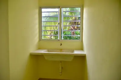 a bathroom with a sink and a window at Hotel la playa in Santa Cruz de Barahona