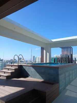 a swimming pool on the roof of a building at a wonderful apt, close to everything you need in Santo Domingo