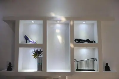 a wall with three windows with a bench in it at Cozy apartment AC, Hot Water, WiFi, Pool, Bar, Bani 203 in Baní