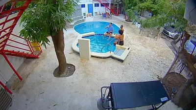 a group of people playing in a swimming pool at Cozy apartment AC, Hot Water, WiFi, Pool, Bar, Bani 203 in Baní