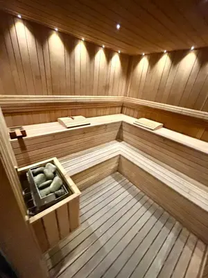 an empty sauna with the inside of it at 1-Bedroom Apartment Balcony, Gym, Pool & BBQ in Santo Domingo