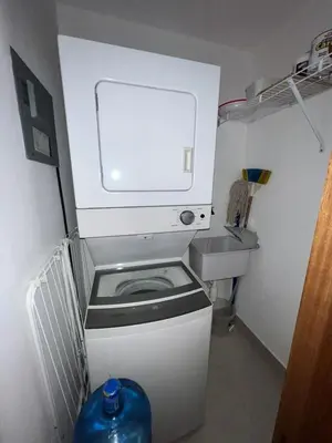 a small bathroom with a toilet and a sink at 1-Bedroom Apartment Balcony, Gym, Pool & BBQ in Santo Domingo