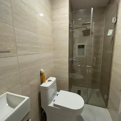 a bathroom with a toilet and a shower and a sink at Your space luxury in naco in Colorado